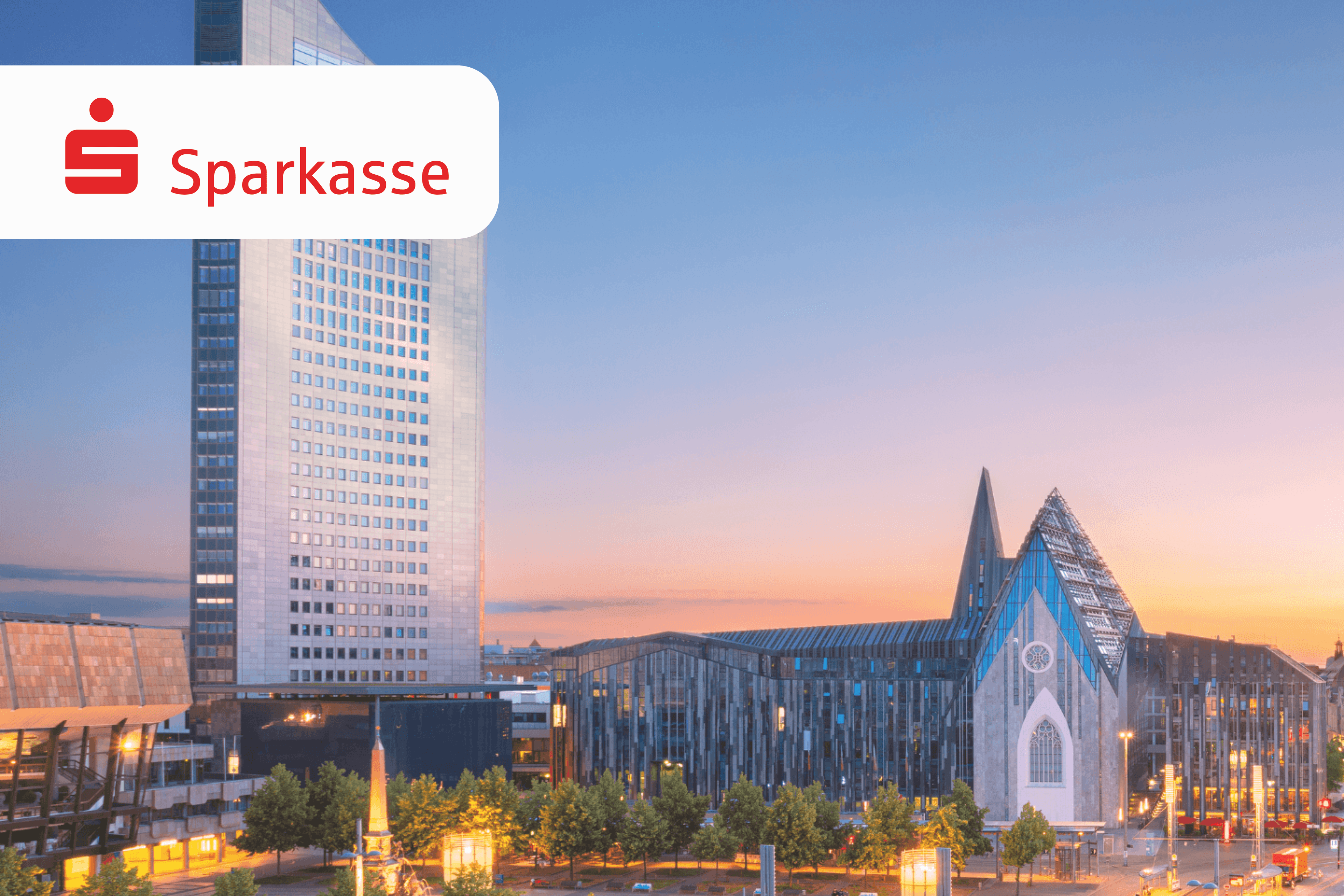 City skyline at dusk with a tall skyscraper and cathedral, featuring the Sparkasse logo.